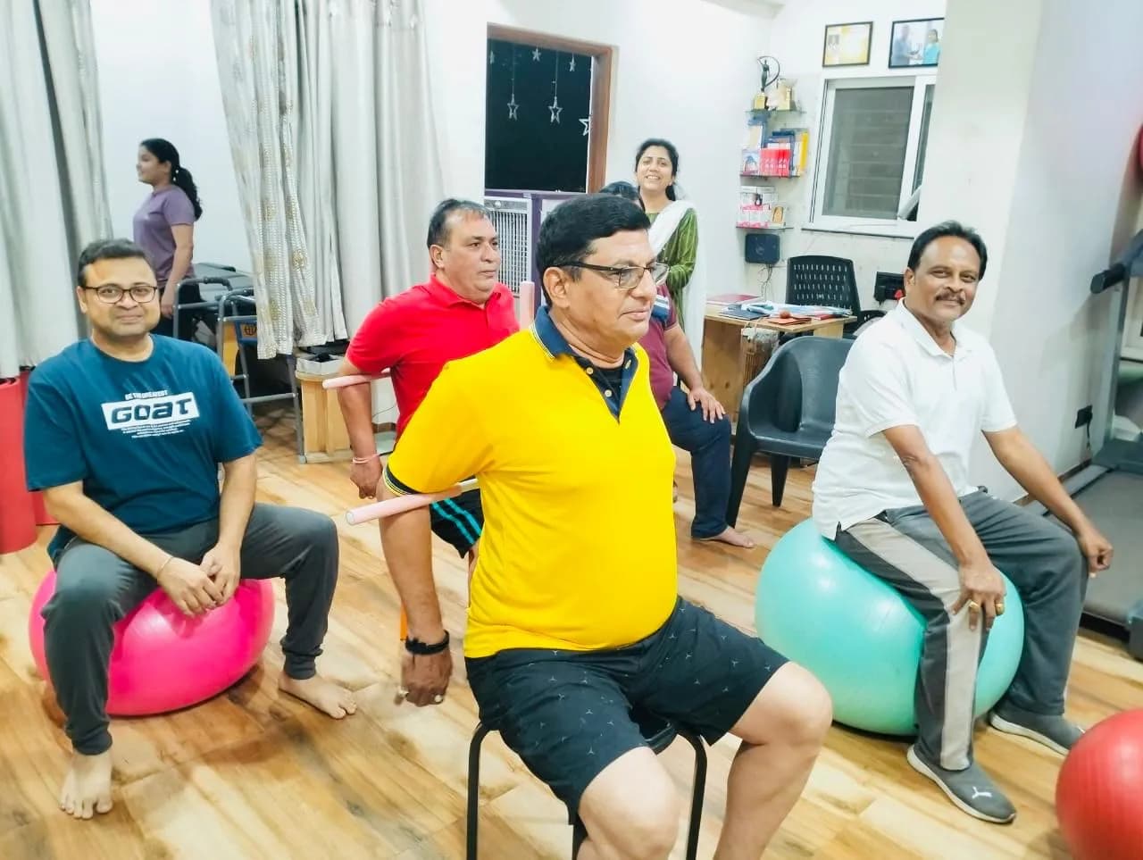 Group exercise class on stability balls at Physiologic