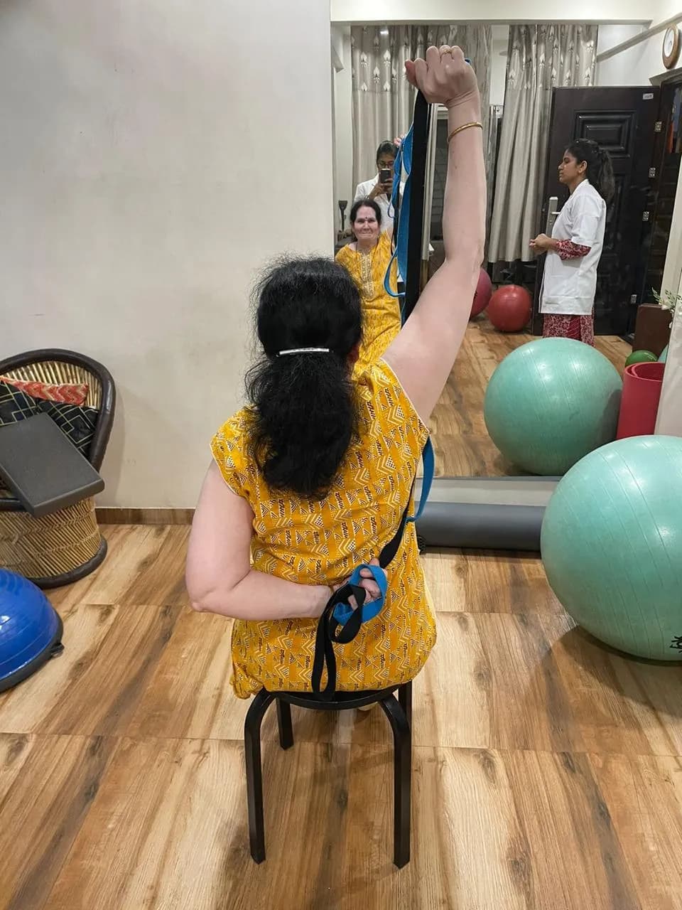 Resistance-band rehabilitation exercise with a patient